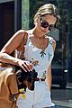emilia clarke cute summer outfit to take dog for a walk 02