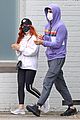 isla fisher sacha baron cohen hold hands day out in sydney 03