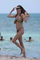 behati prinsloo at the beach while adam levine works out 01
