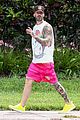 behati prinsloo at the beach while adam levine works out 04