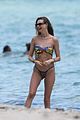 behati prinsloo at the beach while adam levine works out 11