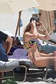 behati prinsloo at the beach while adam levine works out 12