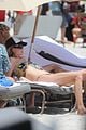 behati prinsloo at the beach while adam levine works out 24