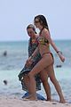 behati prinsloo at the beach while adam levine works out 26