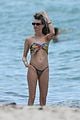 behati prinsloo at the beach while adam levine works out 33