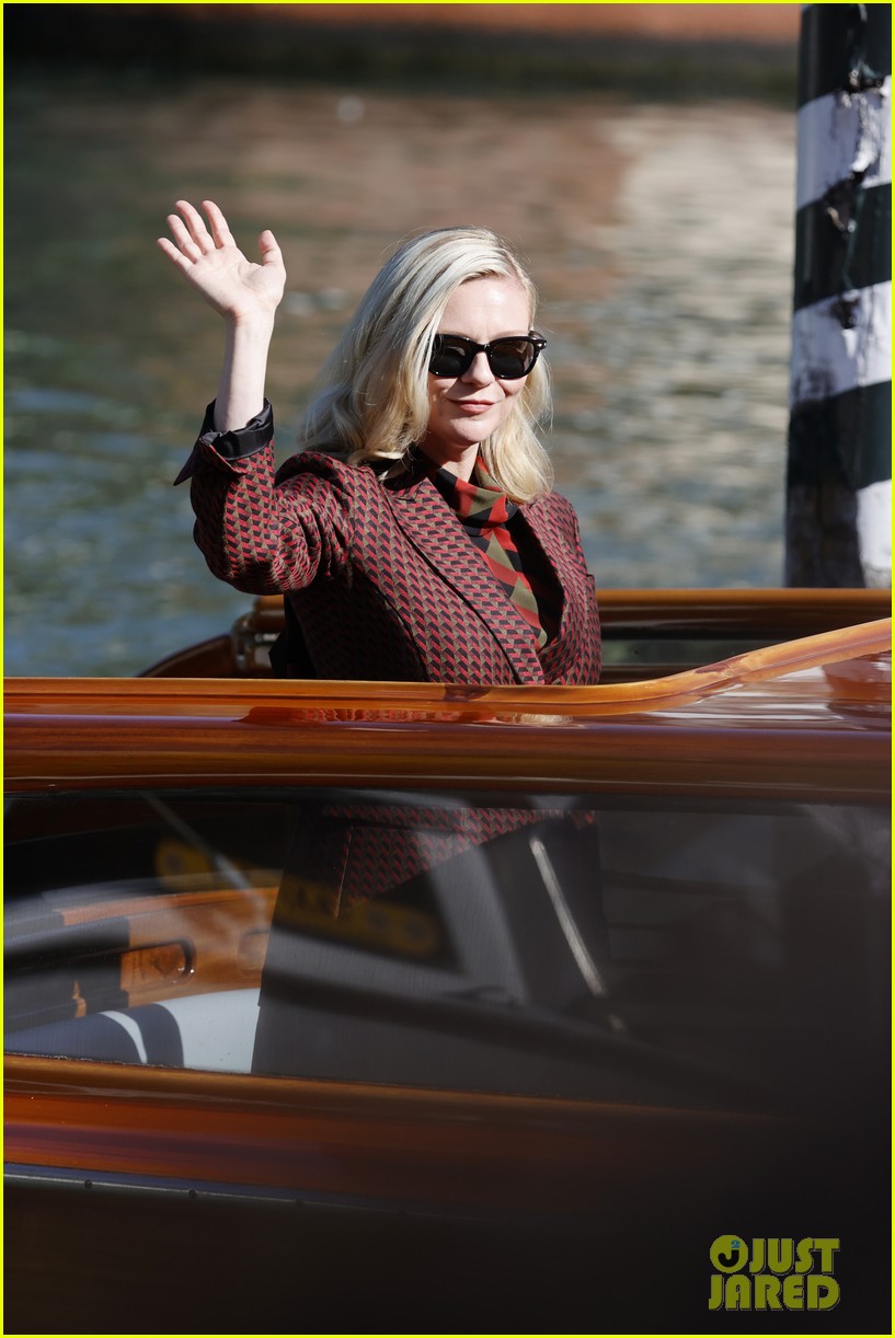 Kirsten Dunst Waves From a Water Taxi After Interviews During Venice