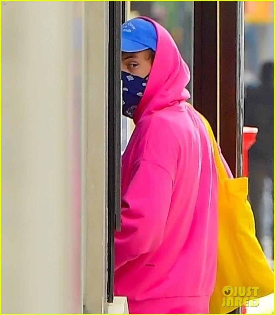 harry styles sports bright pink hooding while hanging out with friends 064637778