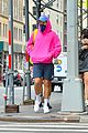 harry styles sports bright pink hooding while hanging out with friends 05