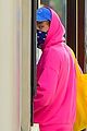 harry styles sports bright pink hooding while hanging out with friends 06