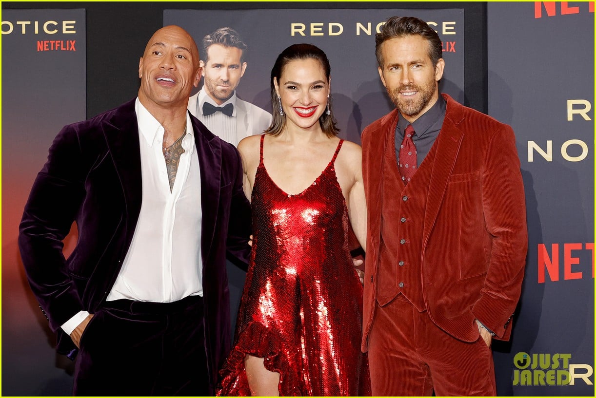 Gal Gadot & Ryan Reynolds Wore Red For 'Red Notice' Premiere With