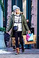 goldie hawn oliver hudson link arms while shopping in aspen 21