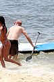 vincent cassel paddleboarding with wife tina kunakey 15