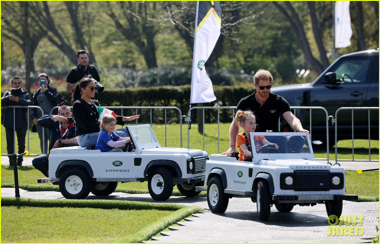 Meghan Markle & Prince Harry Take a Ride in Mini Kiddie Cars at the