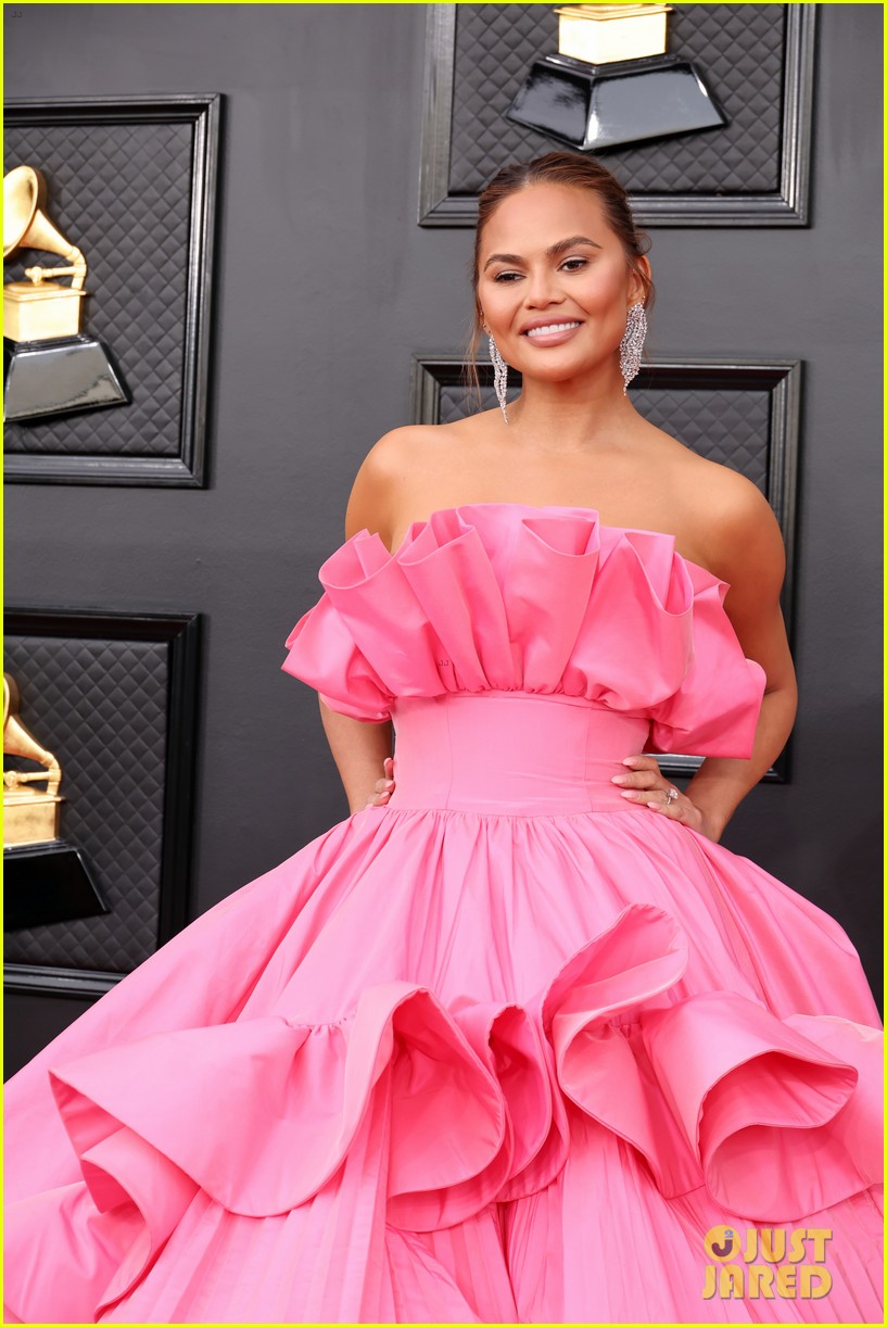 Chrissy Teigen Turns Heads In a Pink Princess Dress For Grammys 2022