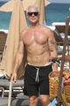 diplo flexes his muscles at the beach miami 02