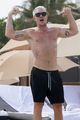 diplo flexes his muscles at the beach miami 04