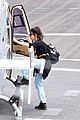 lily james flies out of glastonbury with gemma chan 01