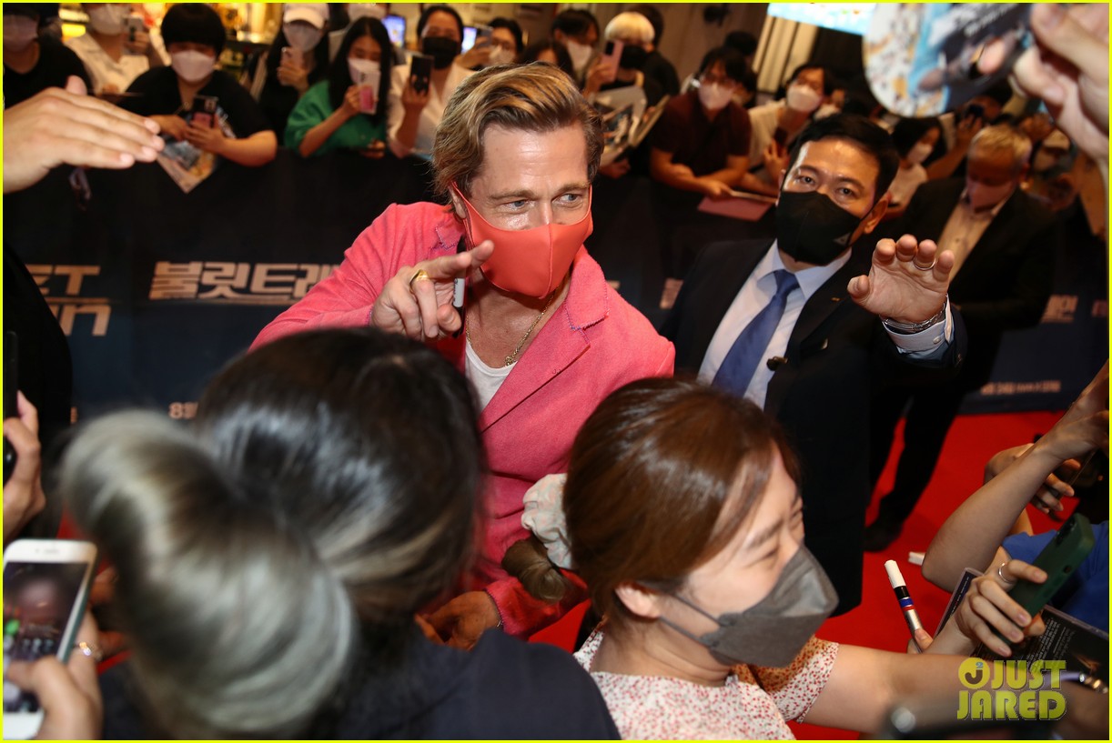 Brad Pitt & Aaron TaylorJohnson Do Adorable Heart Poses at 'Bullet Train' Seoul Premiere