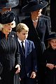 royal family somber queen elizabeths casket leaves abbey 05