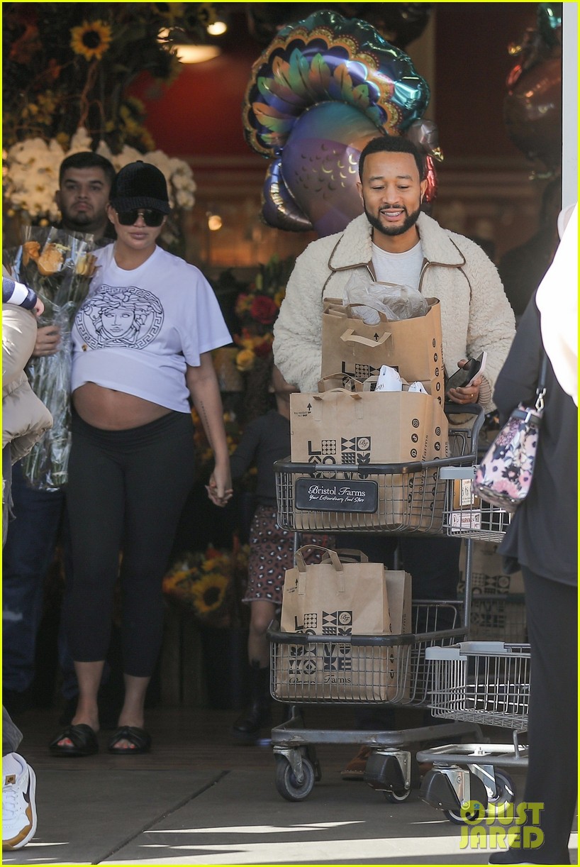 Chrissy Teigen Flashes Her Pregnant Belly While Thanksgiving Shopping