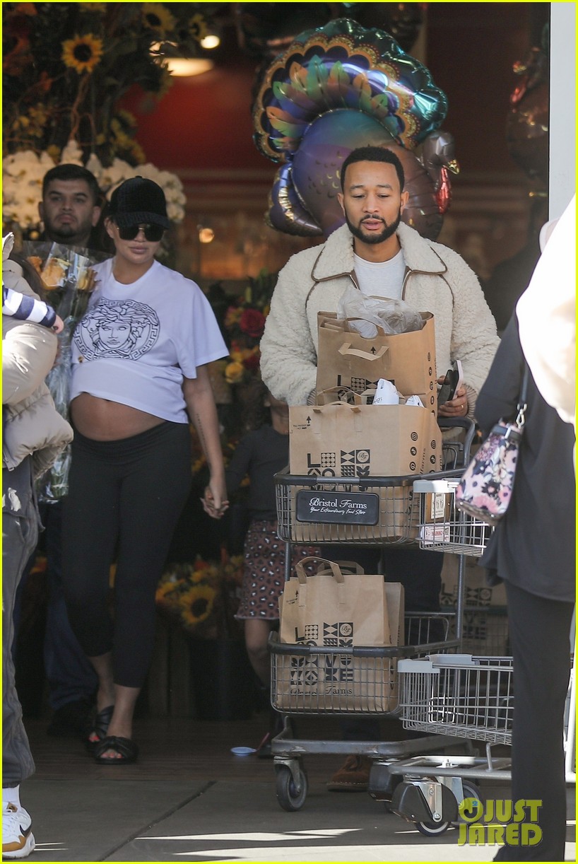 Chrissy Teigen Flashes Her Pregnant Belly While Thanksgiving Shopping