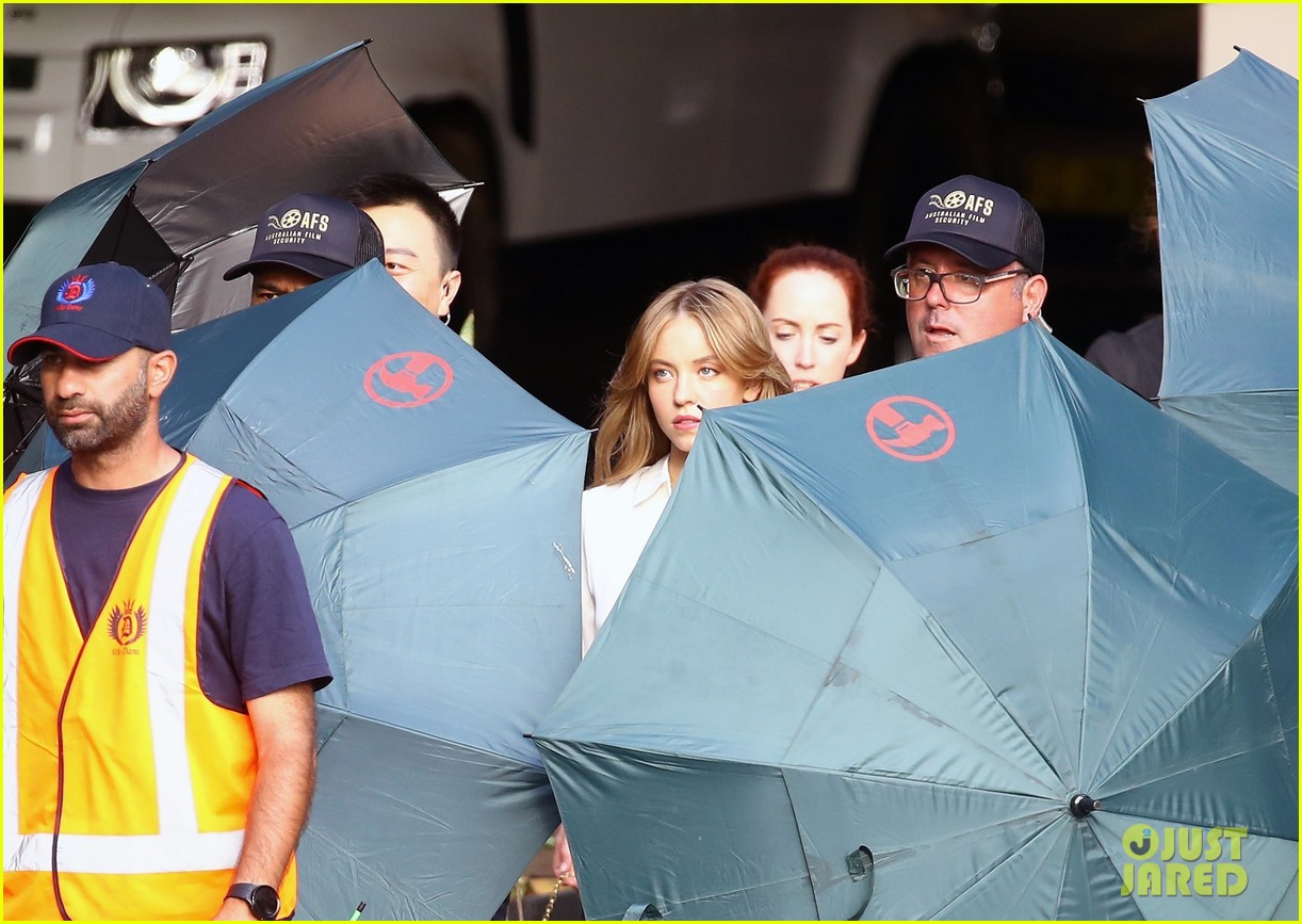 Sydney Sweeney Gets Covered By Giant Umbrellas While Shooting Top