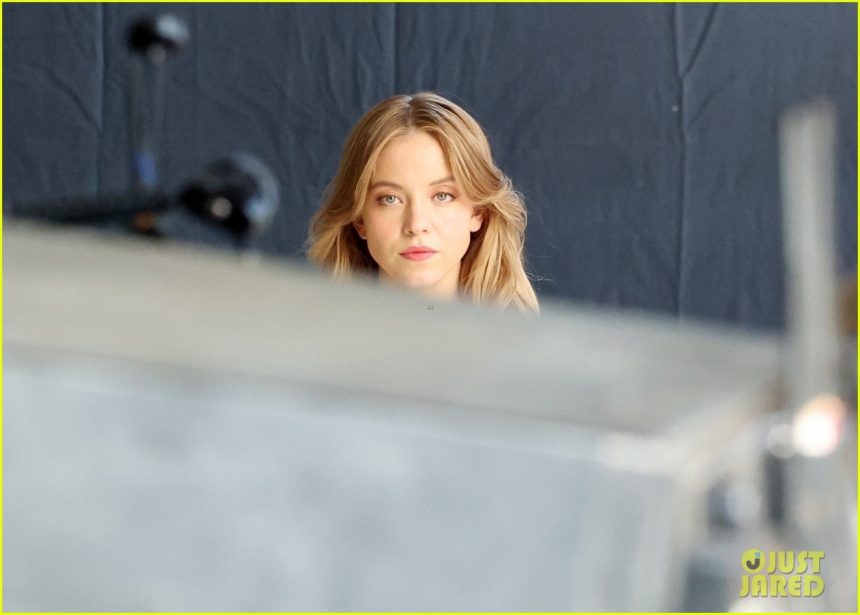 Sydney Sweeney Gets Covered By Giant Umbrellas While Shooting Top