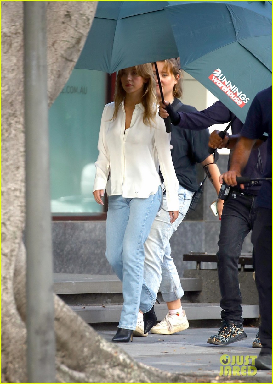 Sydney Sweeney Gets Covered By Giant Umbrellas While Shooting Top