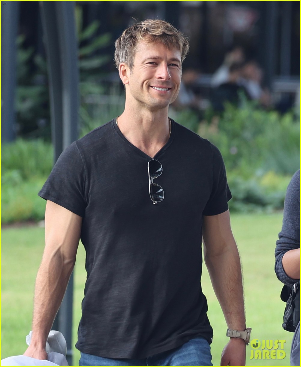 Glen Powell Greets Girlfriend Gigi Paris at the Airport in Australia