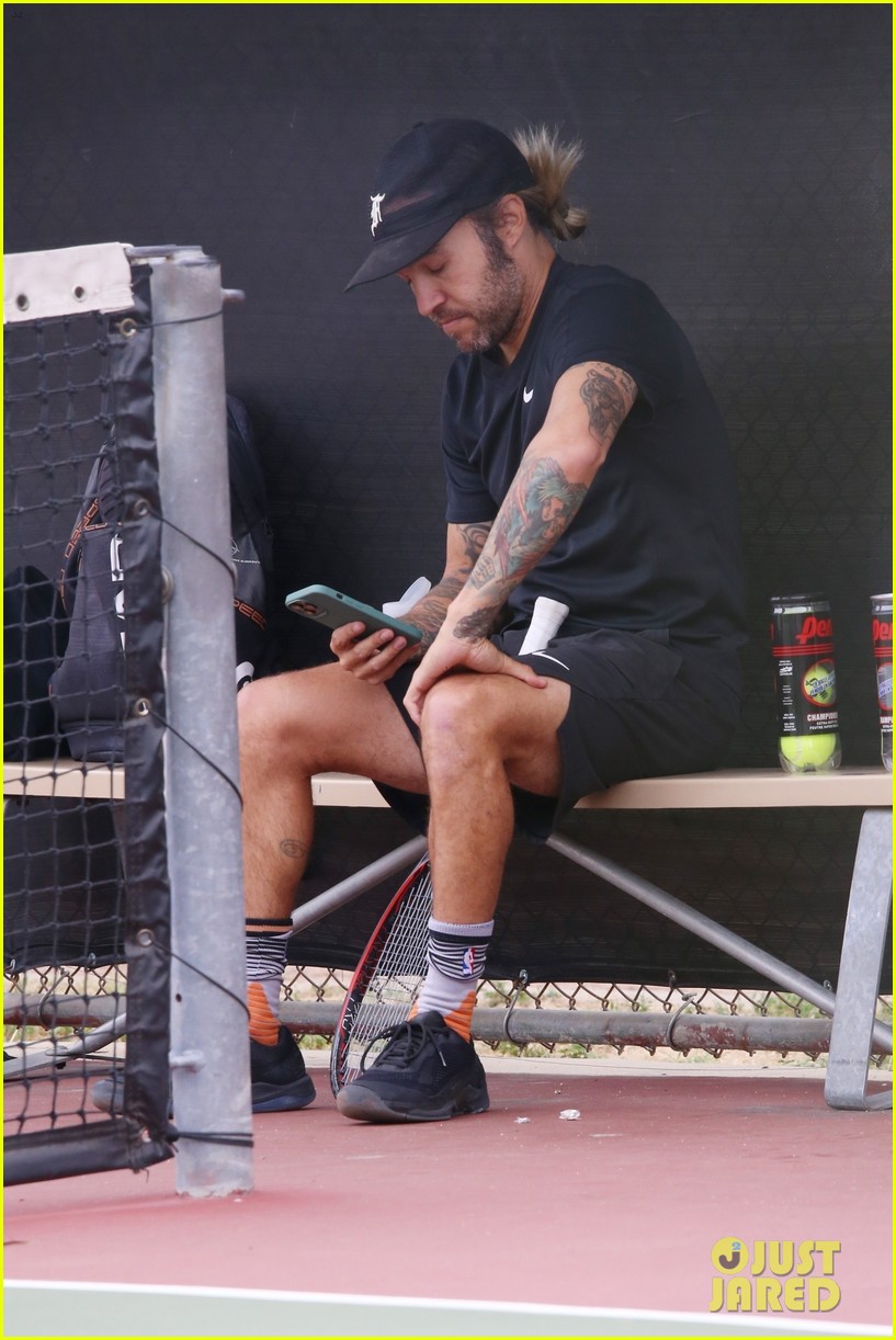 Shirtless Pete Wentz Enjoys a Tennis Match, Shows Off His Long Blonde Hair on the Court Photo