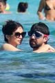 gemma chan dominic cooper kiss on vacation in spain 01
