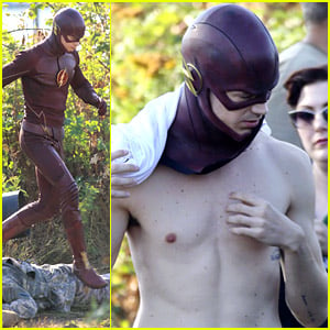 Grant Gustin walks over a fallen body while filming on the set of The Flash in Vancouver,...