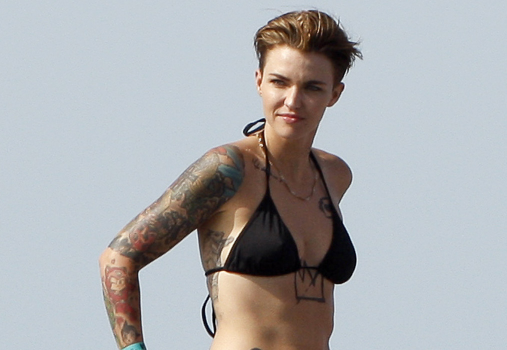 Ruby Rose rocks a bikini and shows off all of her tattoos while on a boat i...