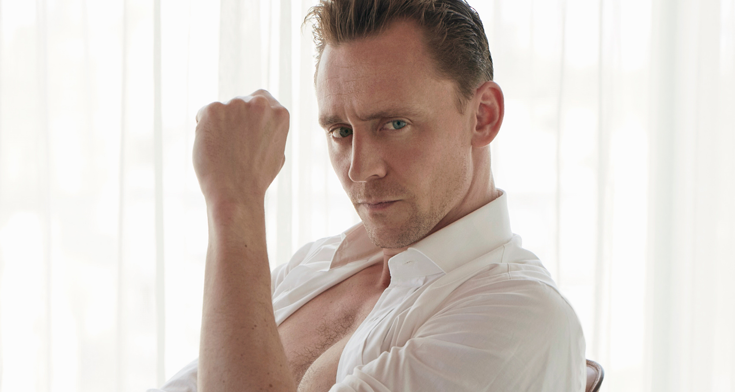 Tom Hiddleston shows off his shirtless body as he strips down to his underw...