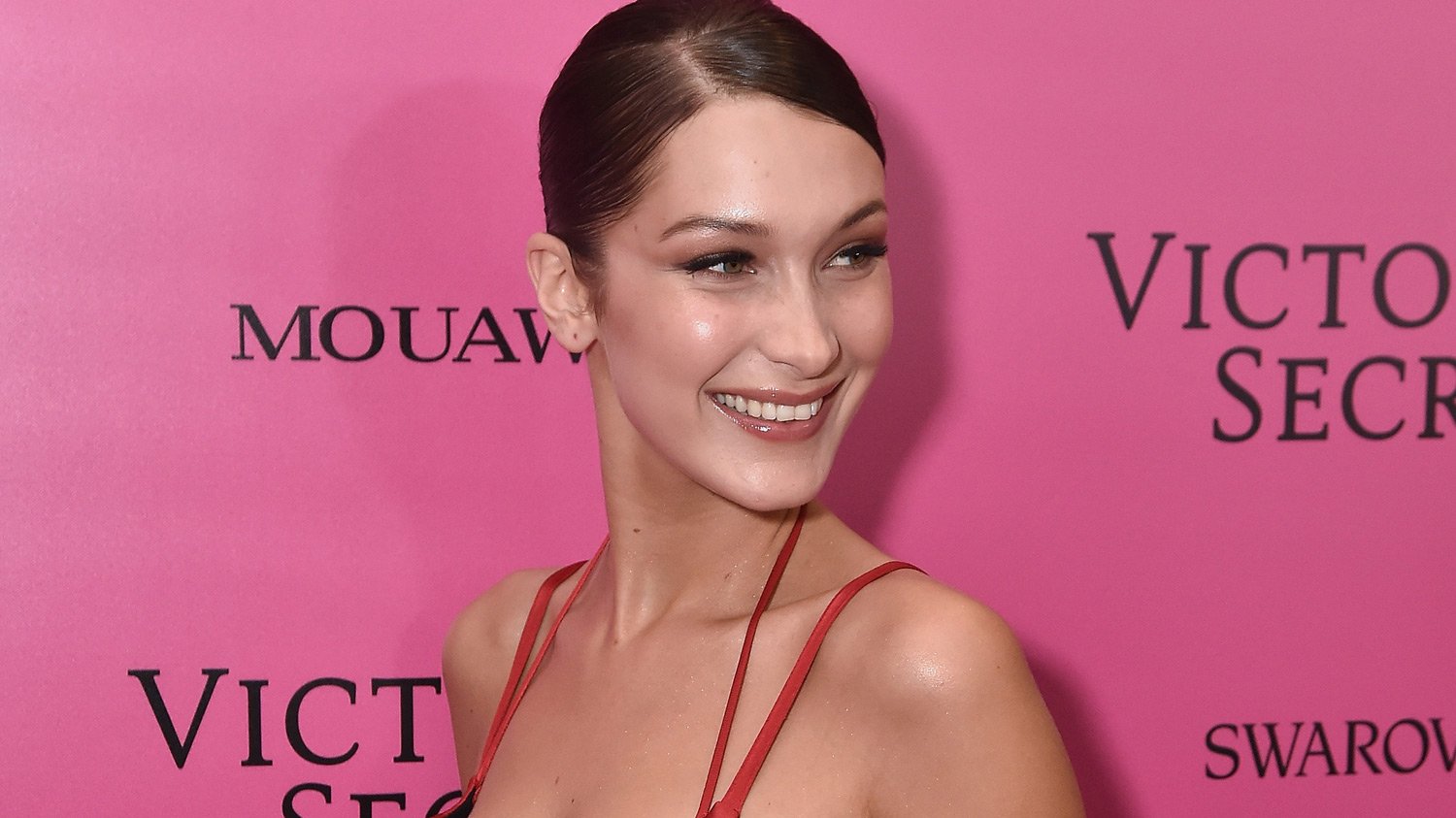 Bella Hadid Stays Smiley in Sexy Red Dress at Victoria’s Secret Fashion