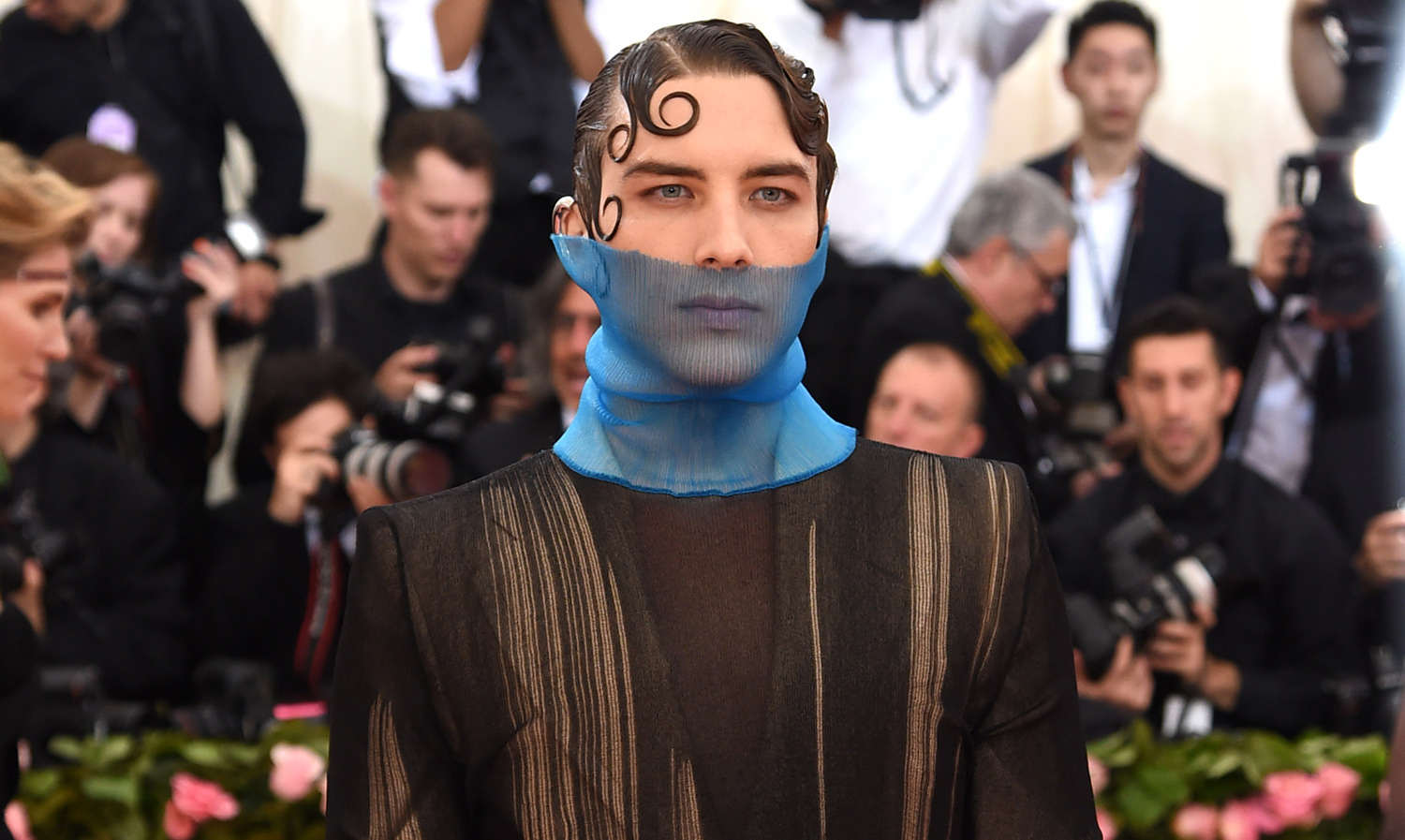 Cody Fern Wears Unique Suit With Blue Cowboy Boots to Met Gala 2019.
