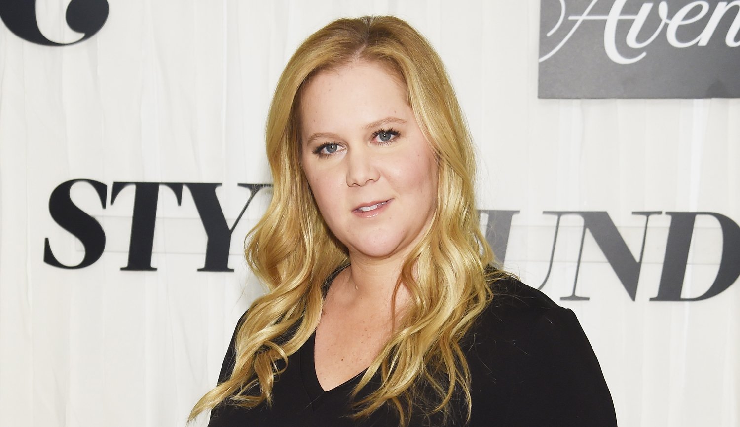 Amy Schumer Lets Fans Know She’s Still Pregnant with New Baby Bump