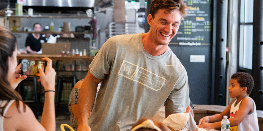 ‘Bachelorette’ Star Tyler Cameron Tosses Pizza Dough for Kids in