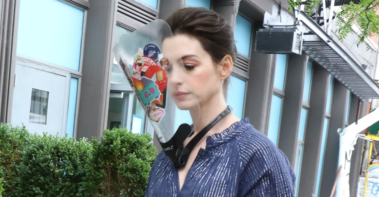 Anne Hathaway Wears Faceshield Covered with Stickers on ‘WeCrashed’ Set