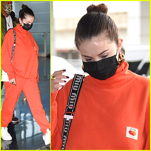 Selena Gomez Rocks Orange Sweatsuit For Flight Out of NYC