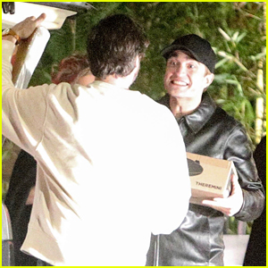 Robert Pattinson Looks Ecstatic with His Holiday Gifts During Night Out with Suki Waterhouse