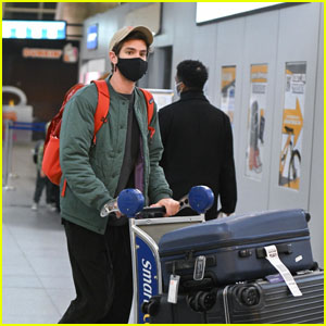 Andrew Garfield Pushes a Cart Full of Luggage After Arriving at JFK Airport
