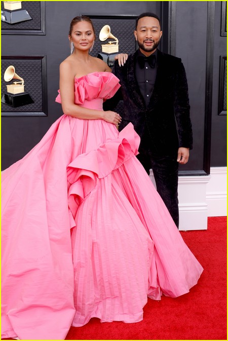 John Legend with wife Chrissy Teigen on the Grammys 2022 red carpet