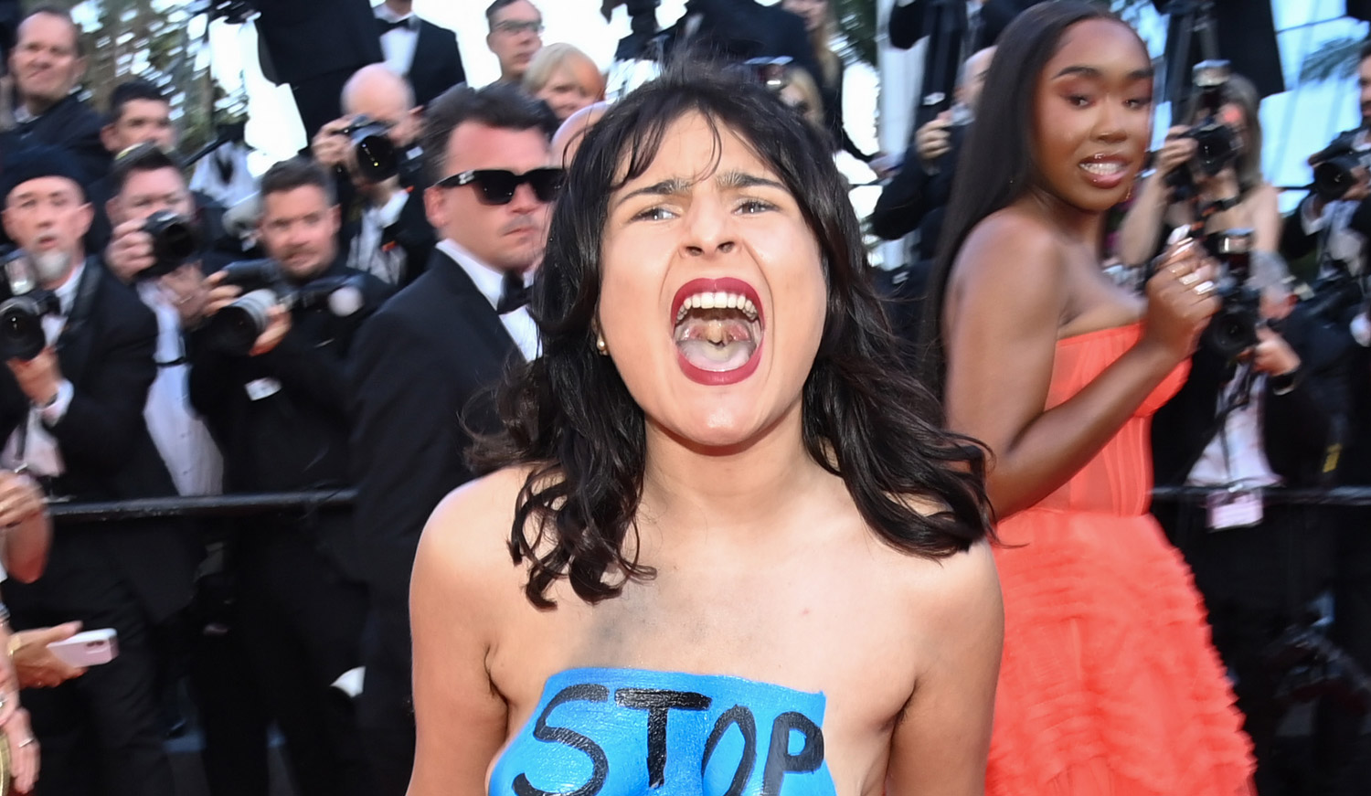 Topless Protester Storms the Red Carpet at Cannes 2022 Premiere – See  Photos - NewsXpro