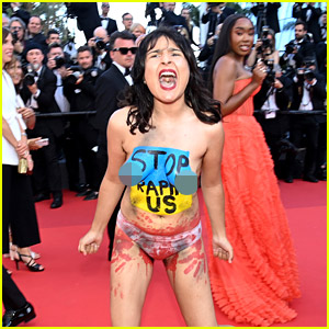 Topless Protester Storms the Red Carpet at Cannes 2022 Premiere - See Photos
