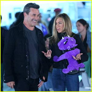 Jon Hamm Wins Jennifer Aniston A Purple Stuffed Toy At The Carnival For 'The Morning Show'