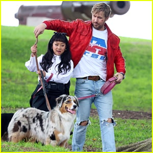 Ryan Gosling & Stephanie Hsu Get Tangled Up With Dogs While Filming