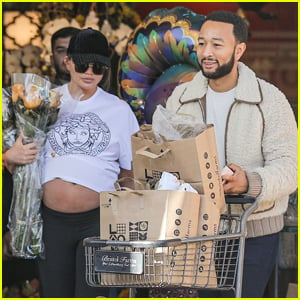 Chrissy Teigen Flashes Her Pregnant Belly While Thanksgiving Shopping with John Legend