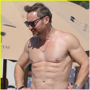 David Guetta Shows Off His Very Toned Abs During a Beach Trip with Girlfriend Jessica Ledon
