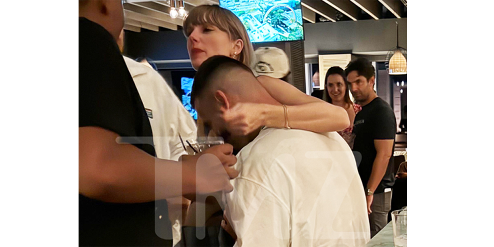 Taylor Swift Wraps Arm Around Travis Kelce in New Photo – See the Pic!